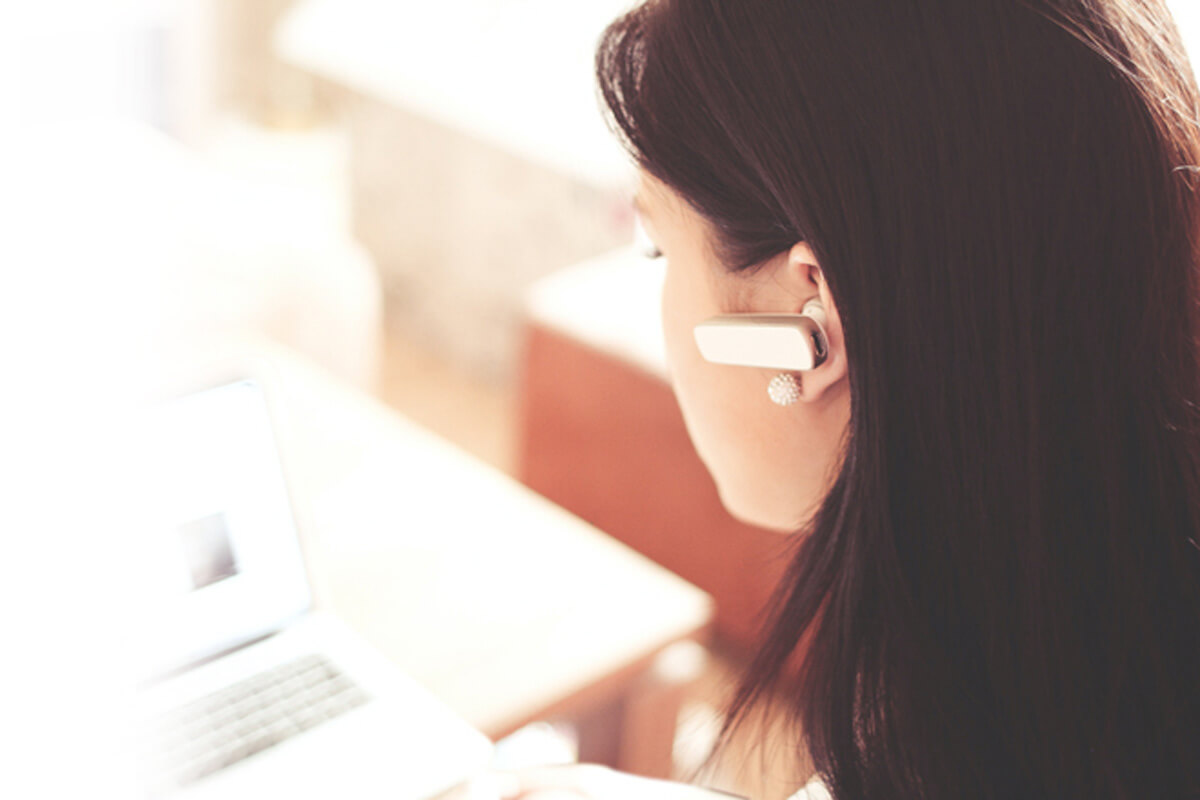 Woman with a bluetooth headset