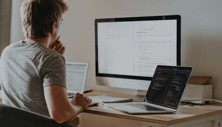 Man works with multiple devices